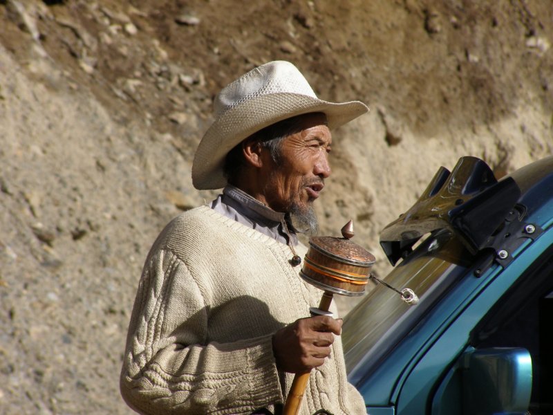 tibetanwithprayerwheel.jpg