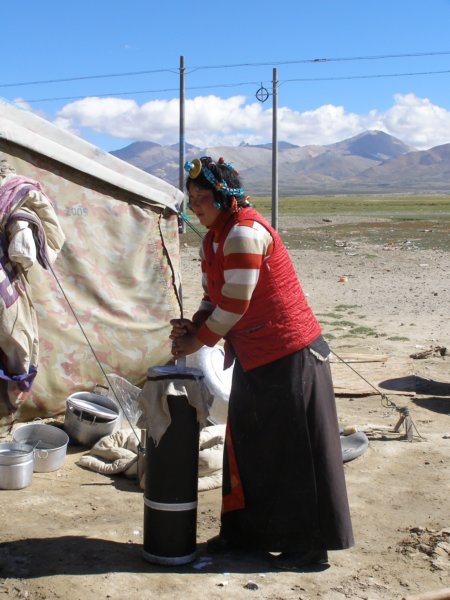 tibetanwomanchurningbutter.jpg
