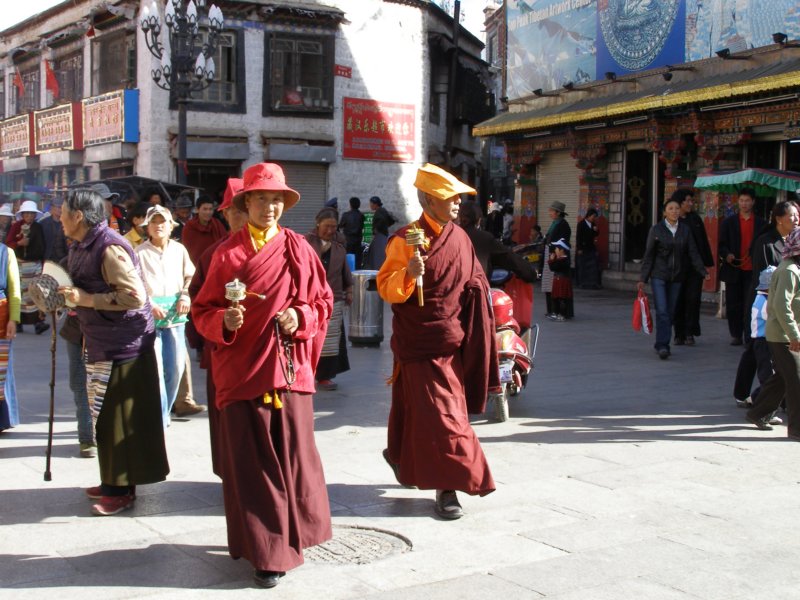 manypilgrimsholdtheprayerwheelstowalkclockwisetherefromdawntodark.jpg